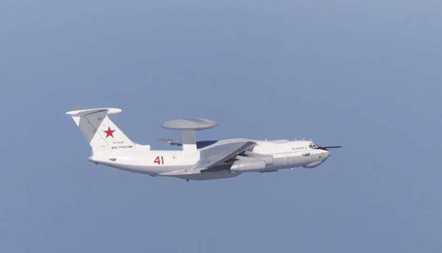 A Russian A-50 military aircraft flies near the disputed islands called Takeshima in Japan and Dokdo in South Korea yesterday.