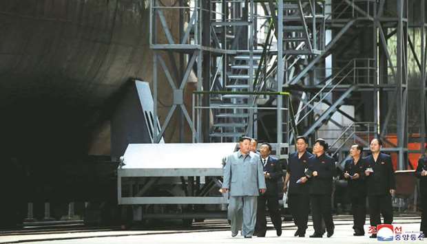 Kim Jong-un visits a submarine factory in an undisclosed location in North Korea, in this undated picture released by North Koreau2019s Central News Agency (KCNA) yesterday.