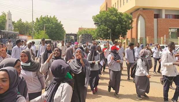 Sudanese university students chant slogans as they march during a demonstration commemorating protesters killed during past clashes, in the centre of the capital Khartoum yesterday.