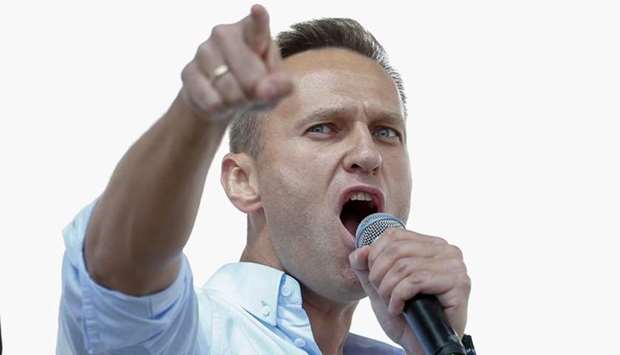 Russian opposition leader Alexei Navalny addresses demonstrators during a rally to support opposition and independent candidates after authorities refused to register them for September elections to the Moscow City Duma on  July 20