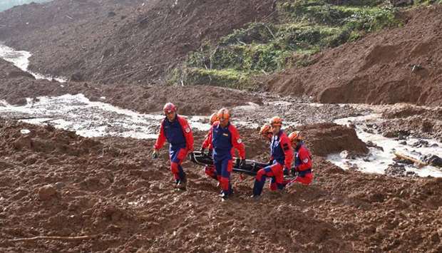 Rescue operations go on at the site of landslide