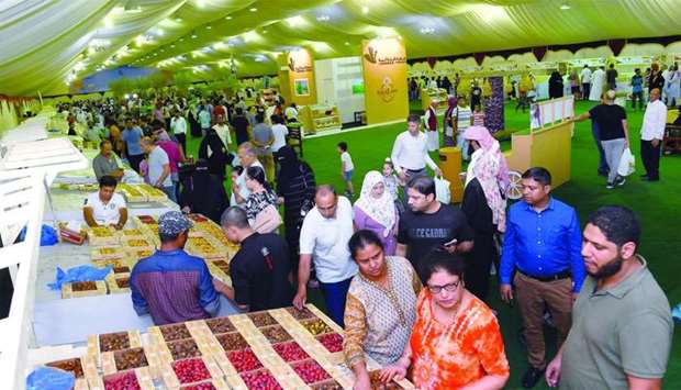 Residents visiting the Local Dates Festival at Souq Waqif.rnrn