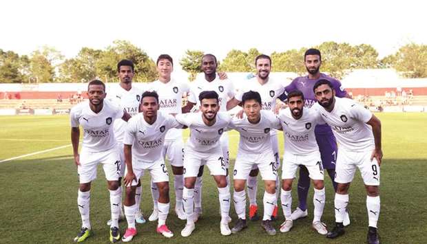 Al Sadd players pose before their friendly match against Olot in Spain.