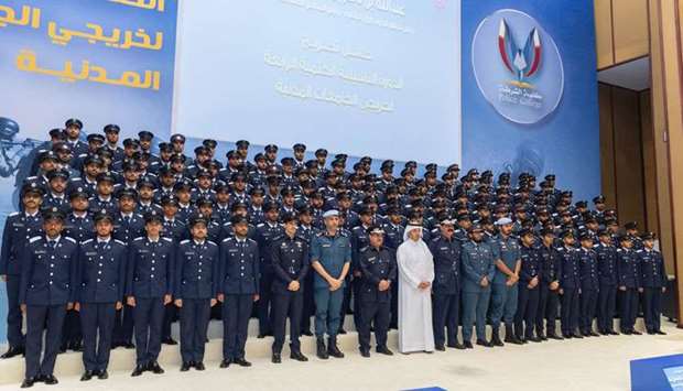 HE the Prime Minister and Interior Minister Sheikh Abdullah bin Nasser bin Khalifa al-Thani with graduates at the graduation ceremony at Police College