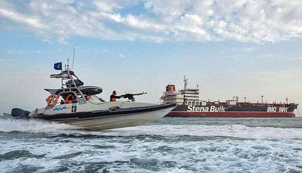 Iranian Revolutionary Guards in speedboats patrolling a tanker Stena Impero as it's anchored off the Iranian port city of Bandar Abbas