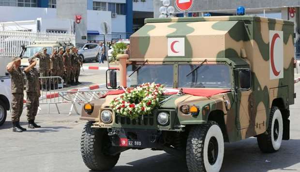 The ambulance carrying the body of Former Tunisian President Beji Caid Essebsi leaves the military hospital in Tunis. AFP