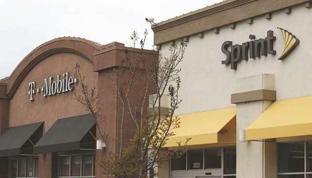 A T-Mobile and Sprint store sit side-by-side in a mall in California. US authorities yesterday approved the $26bn merger of T-Mobile and Sprint in a deal that brings together the third- and fourth-largest operators in the sector.