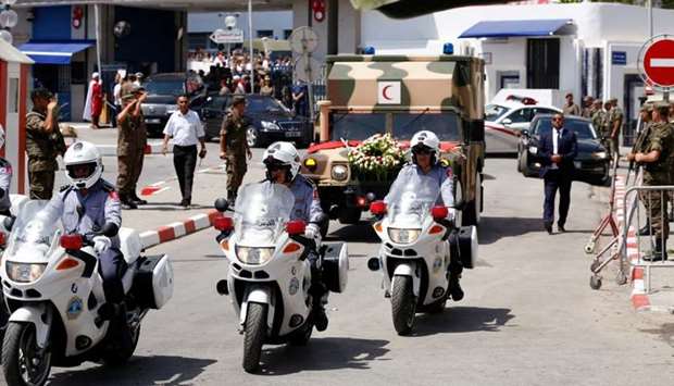 A general view shows an ambulance that carries the body of late Tunisian President Beji Caid Essebsi in Tunis. Reuters