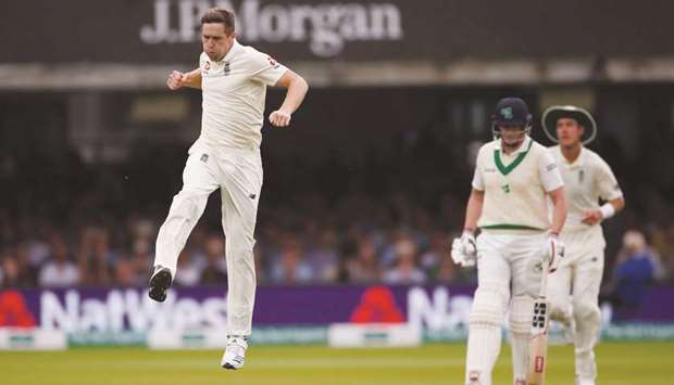Englandu2019s Chris Woakes celebrates taking the wicket of Irelandu2019s James McCollum on third day of the Test at Lordu2019s in London yesterday. (Reuters)