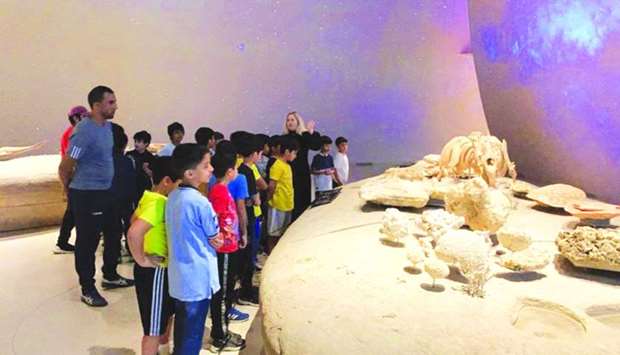 Children view one of the exhibits at the museum