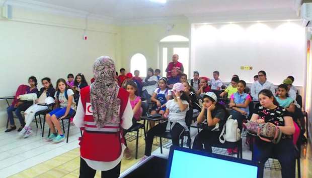 A group of students attending a health education session organised by QRCS.