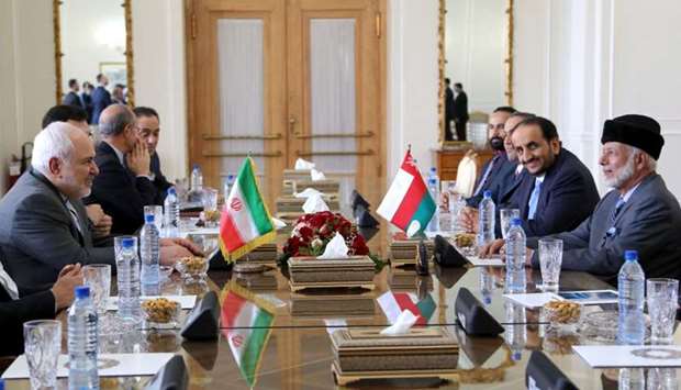 Oman's Minister of State for Foreign Affairs Yousuf bin Alawi bin Abdullah (R) attends a meeting with Iran's Foreign Minister Mohammad Javad Zarif in Tehran