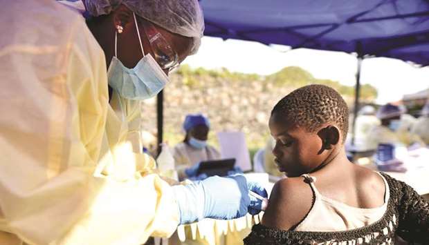 A Congolese health worker administers Ebola vaccine to a child at the Himbi Health Centre in Goma, Democratic Republic of Congo.
