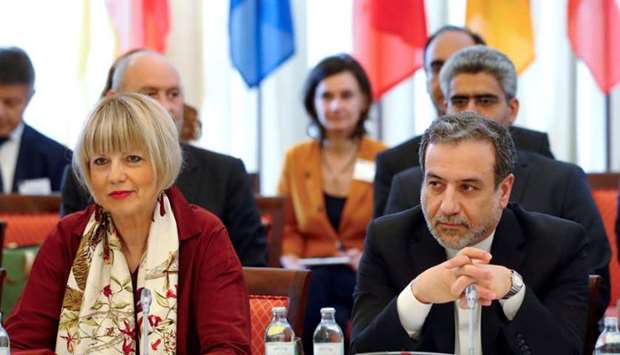 Iran's top nuclear negotiator Abbas Araqchi and Secretary General of the European External Action Service (EEAS) Helga Schmid attend a meeting of the JCPOA Joint Commission in Vienna, Austria