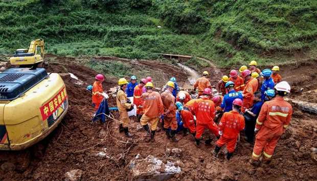 Rescuers working at the site of a landslide in Liupanshui in China's southwestern Guizhou province
