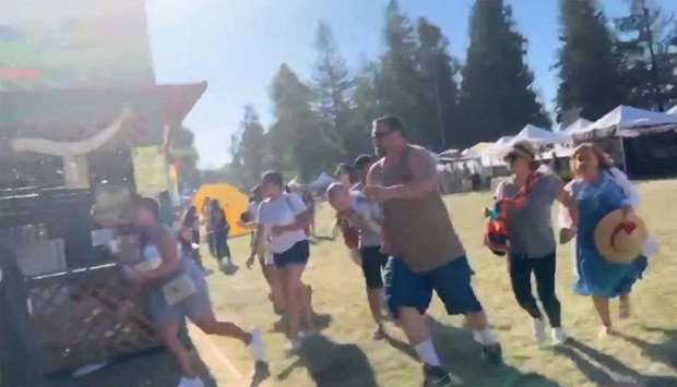 Social media video grab of people running away as an active shooter was reported at the Gilroy Garlic Festival, south of San Jose, California