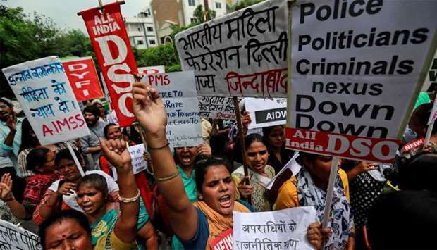 Protest demanding investigation in highway collision in which woman fighting rape case against BJP legislator was injured, in New Delhi