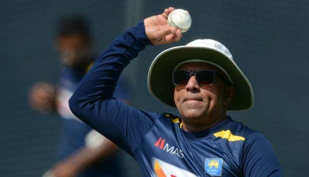 Sri Lankan cricket team head coach Chandika Hathurusingha throws a ball during a practice session at R.Premadasa Stadium in Colombo