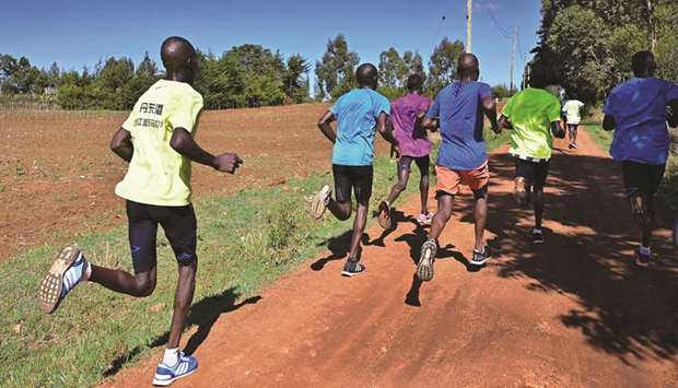 Marathon runners carry out a u2018speed-worku2019 along the back roads of Iten, known colloquially as the u2018worldu2019s running capitalu2019, legendary for producing some of Kenyau2019s most elite athletes and a training ground for other international top distance runners on May 9, 2019. (AFP)
