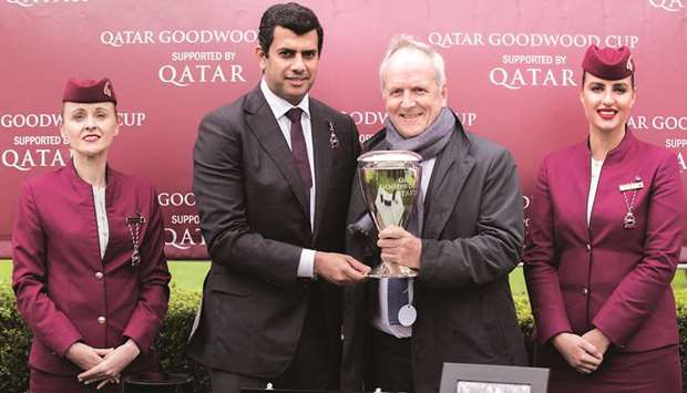 Qatar Equestrian Federation president Hamad Abdulrahman al-Attiyah (second from left) presents the owneru2019s trophy for the Qatar Goodwood Cup Stakes (Group 1) after Stradivarius won the two-mile contest at Qatar Goodwood Festival yesterday. PICTURES: Juhaim & Zuzanna Lupa