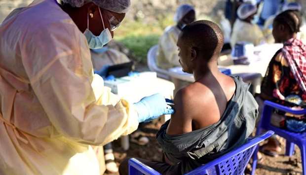 A Congolese health worker administers an Ebola vaccine to a man at the Himbi Health Centre in Goma, Democratic Republic of Congo on July 1.