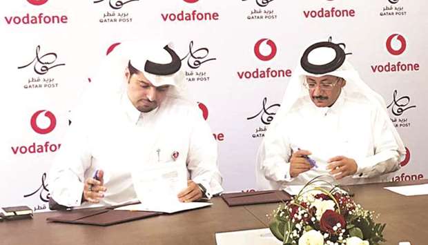 Sheikh Hamad Abdulla al-Thani and Faleh bin Mohamed al-Naemi signing the agreement yesterday.