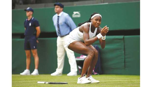 Cori Gauff of the US celebrates winning her first round match against Venus Williams. At bottom, Serena Williams.