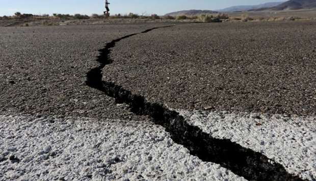 Fissures that opened up under a highway during a powerful earthquake that struck Southern California are seen near the city of Ridgecrest, California