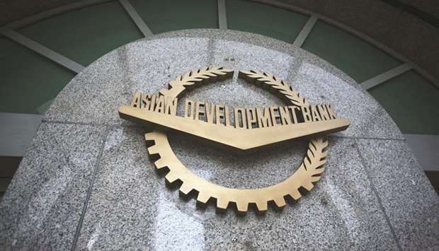 The sign for Asian Development Bank is displayed at its headquarters in Manila. The ADB yesterday approved a $235mn loan to help develop the bus rapid transit system in Karachi, Pakistanu2019s largest city.