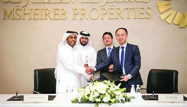 Msheireb Properties and Huawei officials at the cooperation agreement signing ceremony