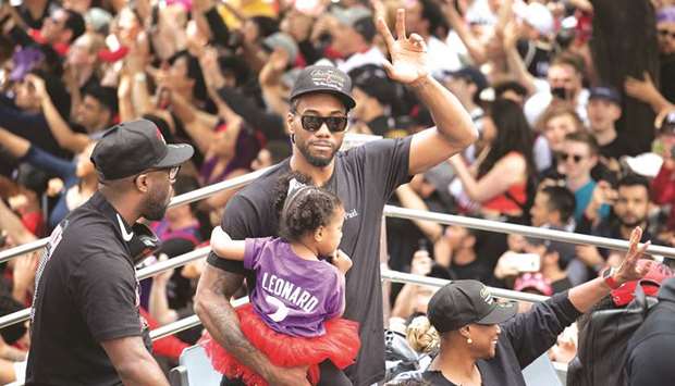 In this June 17, 2019, picture, forward Kawhi Leonard acknowledges the crowd during the Toronto Raptors NBA Championship Parade in Toronto, Canada. (USA TODAY Sports)