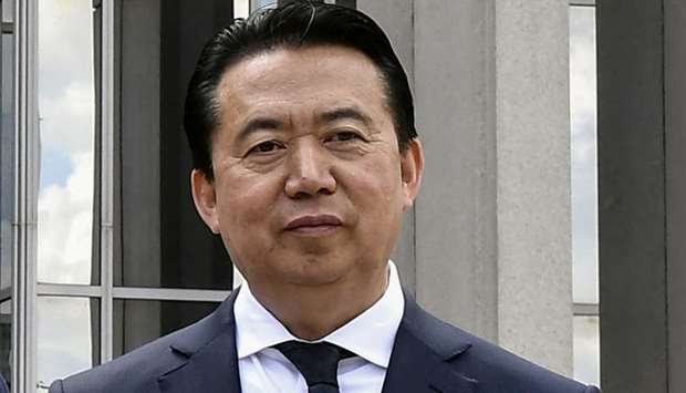 Interpol President Meng Hongwei poses during a visit to the headquarters of International Police Organisation in Lyon, France, May 8, 2018