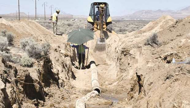 Cal-Trans workers on Saturday fixed an 11 inch water main break after an earthquake near Ridgecrest, California.
