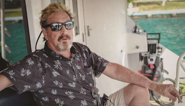 US millionaire John McAfee gestures during an interview with AFP on his yacht anchored at the Marina Hemingway in Havana.