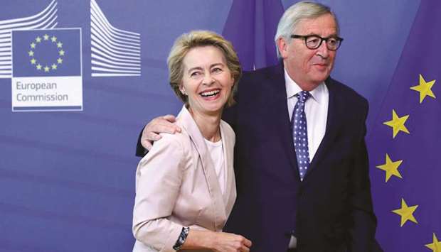 FILE PHOTO: German Defence Minister Ursula von der Leyen, who has been nominated as European Commission President, poses with EU Commission President Jean-Claude Juncker at the EU Commission headquarters in Brussels, Belgium, July 4, 2019.