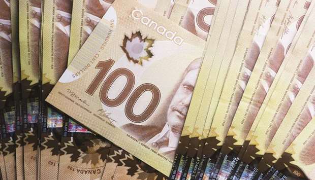 Canadian dollar banknotes are arranged for a photograph in Toronto.