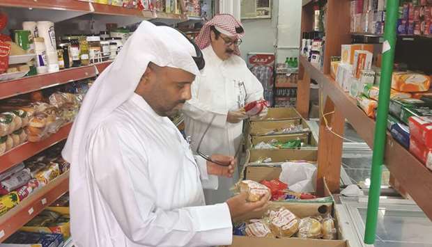 Food safety officials conduct an inspection.