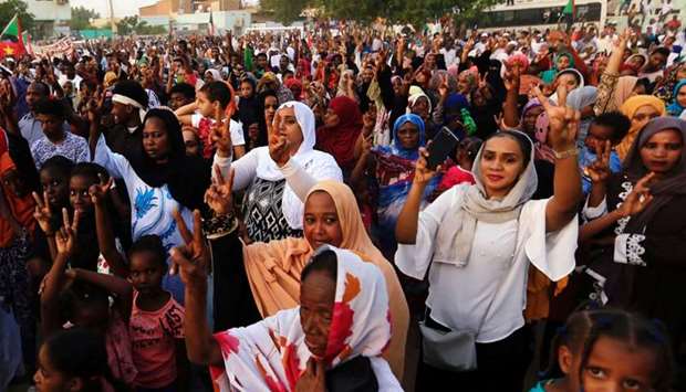 Sudanese people chant slogans as they celebrate, after Sudan's ruling military council and a coalition of opposition and protest groups reached an agreement to share power during a transition period leading to elections, along the streets of Khartoum, Sudan on July 5