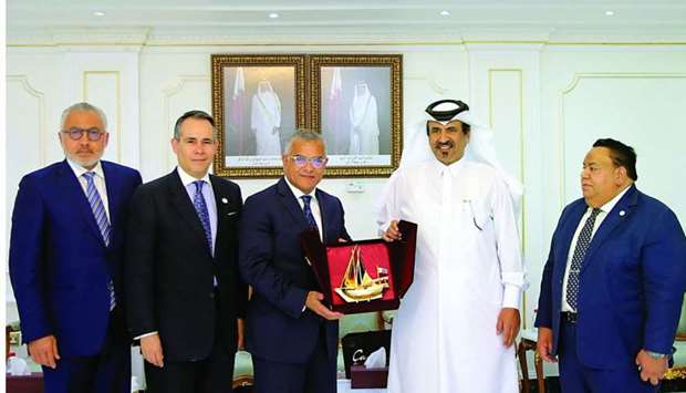 Qatar Chamber first vice-chairman Mohamed bin Towar al-Kuwari hands over a token of recognition to Dominican Republicu2019s Deputy Minister of Foreign Affairs Dr Carlos Gabriel Garcia during a meeting held in Doha.