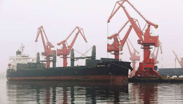 A crude oil tanker is seen at Qingdao Port, Shandong province. Chinau2019s fuel producers are making extended curbs to their output in the third quarter after supply from mammoth new refineries stoked an already-sizeable glut, potentially dragging on crude oil demand from the worldu2019s biggest importer of the commodity.