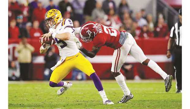 Joe Burrow (left) of the LSU Tigers in action against the Alabama Crimson Tide during a regular NFL game at Bryant-Denny Stadium on November 9, 2019. (TNS)