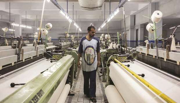 A worker inspects fabric on looms at a textile manufacturer in Karachi. Statistics in the World Bank brief show that the domestic spending percentage of the whole economy GDP in Pakistan on tourism is 4.09%, while the percentage of flow of South Asia intra regional visitors placed Pakistan at 3.25%.