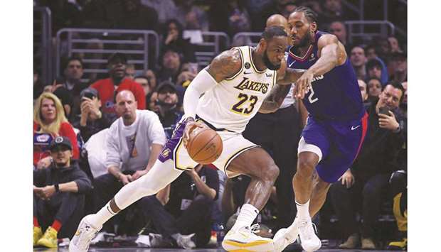 LeBron James (left) of the Los Angeles Lakers in action against the LA Clippers during a regular NBA game at Staples Center on March 8, 2020. (TNS)