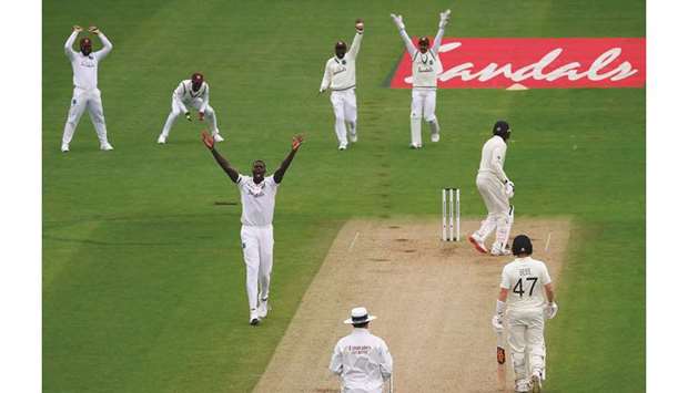 West Indiesu2019 Jason Holder (third from left) appeals successfully for the wicket of Englandu2019s Jofra Archer (second from right) on the second day of the first Test in Southampton, United Kingdom, yesterday. (AFP)