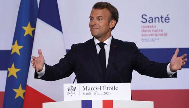 French President Emmanuel Macron gestures as he delivers a speech at French drugmakeru2019s vaccine unit Sanofi Pasteur plant, in Marcy-lu2019Etoile, near Lyon, France, yesterday. Macron pledged u20ac200mn to help domestic research and manufacturing of medicines.