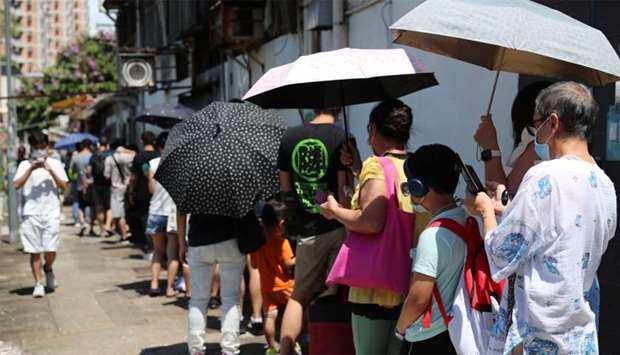 People queue to vote for New Territory East candidates during a primary election in Hong Kong