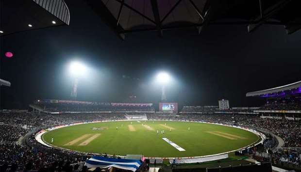 file photo:  Cricketers play under floodlights at the Eden Gardens cricket stadium in Kolkata