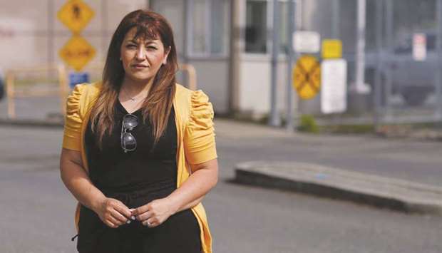 Sandra Videla, whose Guatemalan husband Timoteo Vicente-Chun is detained at the Northwest ICE Processing Centre, poses outside the facility in Tacoma, Washington, US, on June 29.