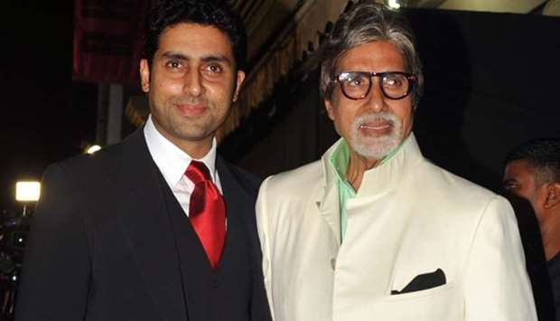 Bollywood actors Amitabh Bachchan (R) and his son Abhishek Bachchan pose during the inauguration of a furniture showroom by actors Sunil and Mana Shetty in Mumbai. File picture: January 12, 2013