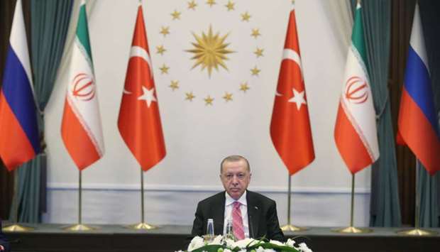 Turkish President Tayyip Erdogan attends a video conference call, dedicated to the conflict in Syria, with Russia's President Vladimir Putin and Iran's President Hassan Rouhani in Ankara, Turkey